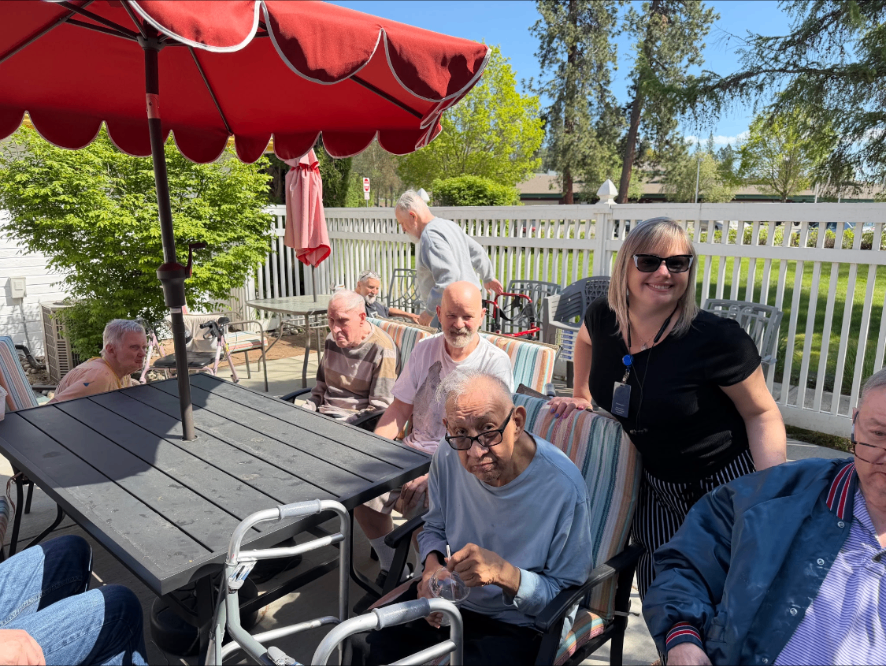 Sunny afternoon on the patio with staff and residents