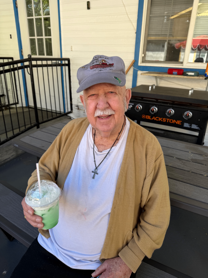 Resident enjoying a shamrock shake on the patio